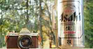 An image of a canned Asahi beer and film camera
