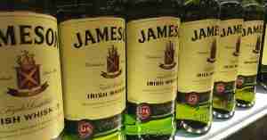 A row of Jameson Whiskey on a shelf