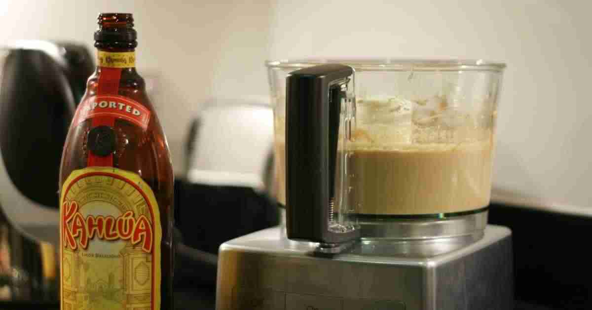 An image of a bottled Kahlua besides a process coffee