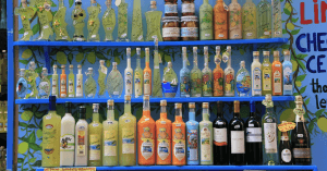 A shelf full of lemon-flavored liqueurs