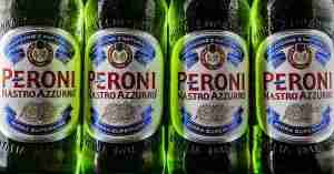A close-up image of Peroni Nastro Azzurro beers, focusing on the labeling