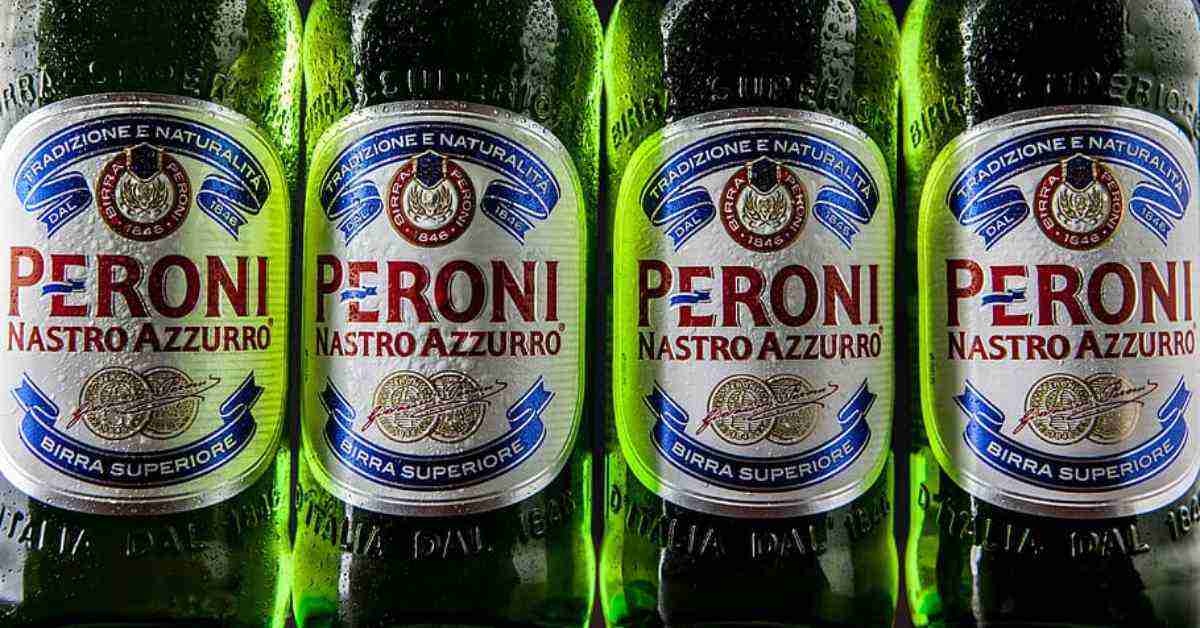 A close-up image of Peroni Nastro Azzurro beers, focusing on the labeling
