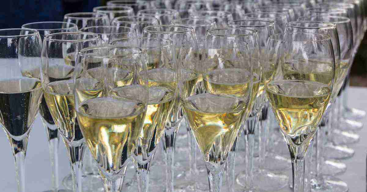 A collection of wine glasses with prosecco