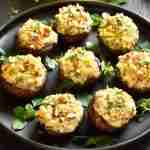A top view image of plate full with mushroom dish following gluten-free stuffed mushroom recipes