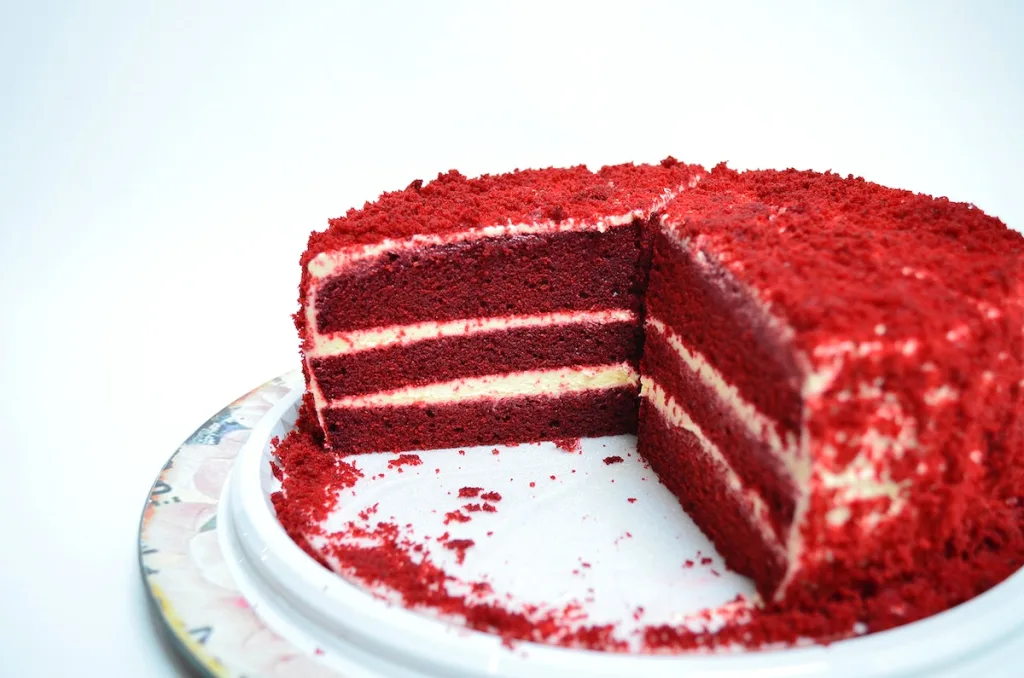 An image of gluten-free red velvet cake with buttercream filling