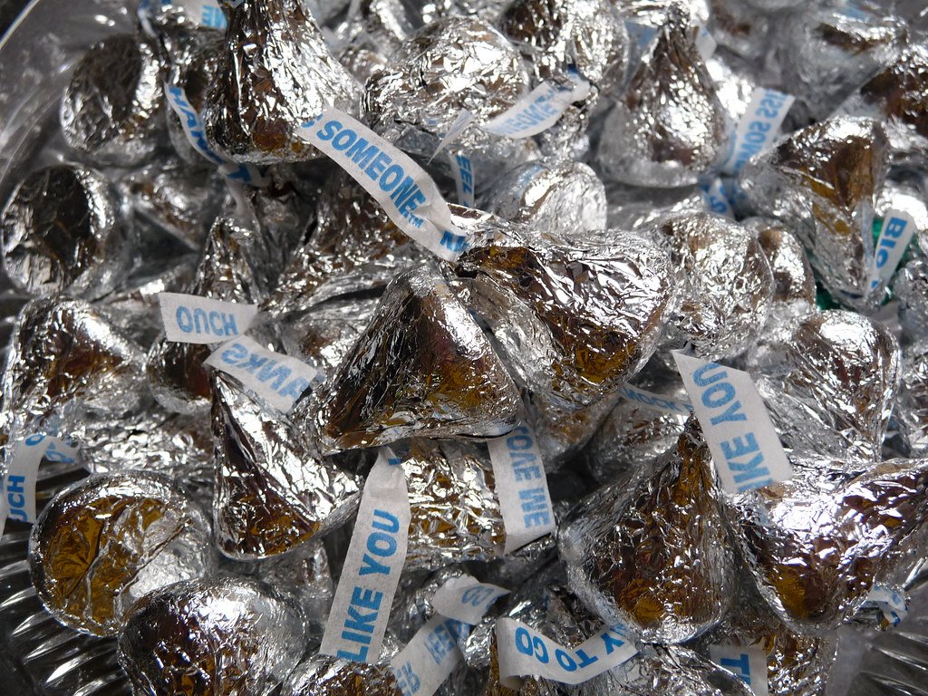 A bunch of Hershey's Kisses on a bowl