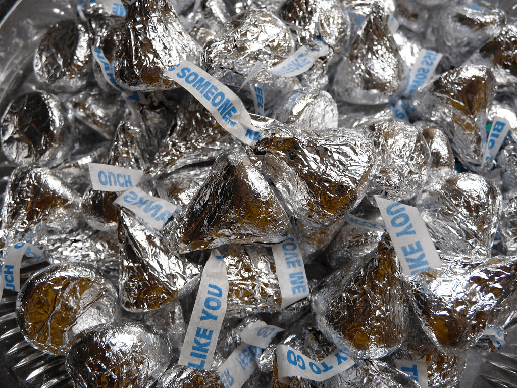 A bunch of Hershey's Kisses on a bowl