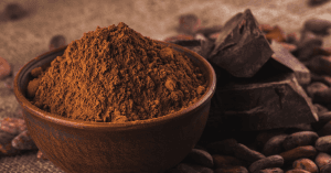 Is Cocoa Gluten-Free? An image of bowl of cocoa powder and cocoa beans