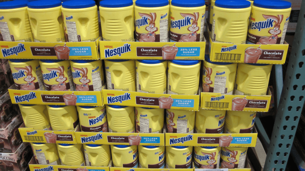 A shelf full of Nesquik Bottles