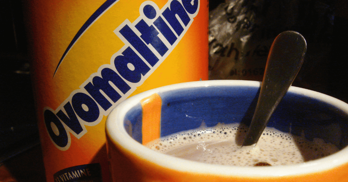 Is Ovaltine gluten-free? An image of Ovaltine in a can and a glass of hot chocolate